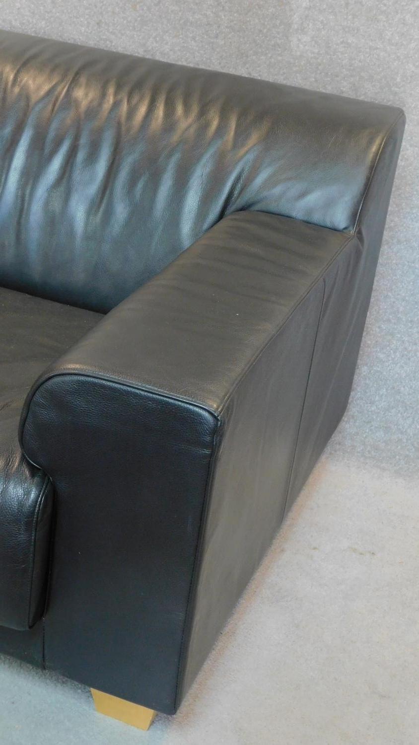 An Italian black leather sofa on solid block feet. 73x177x97cm (bought from Heal's, pair to the - Image 3 of 4