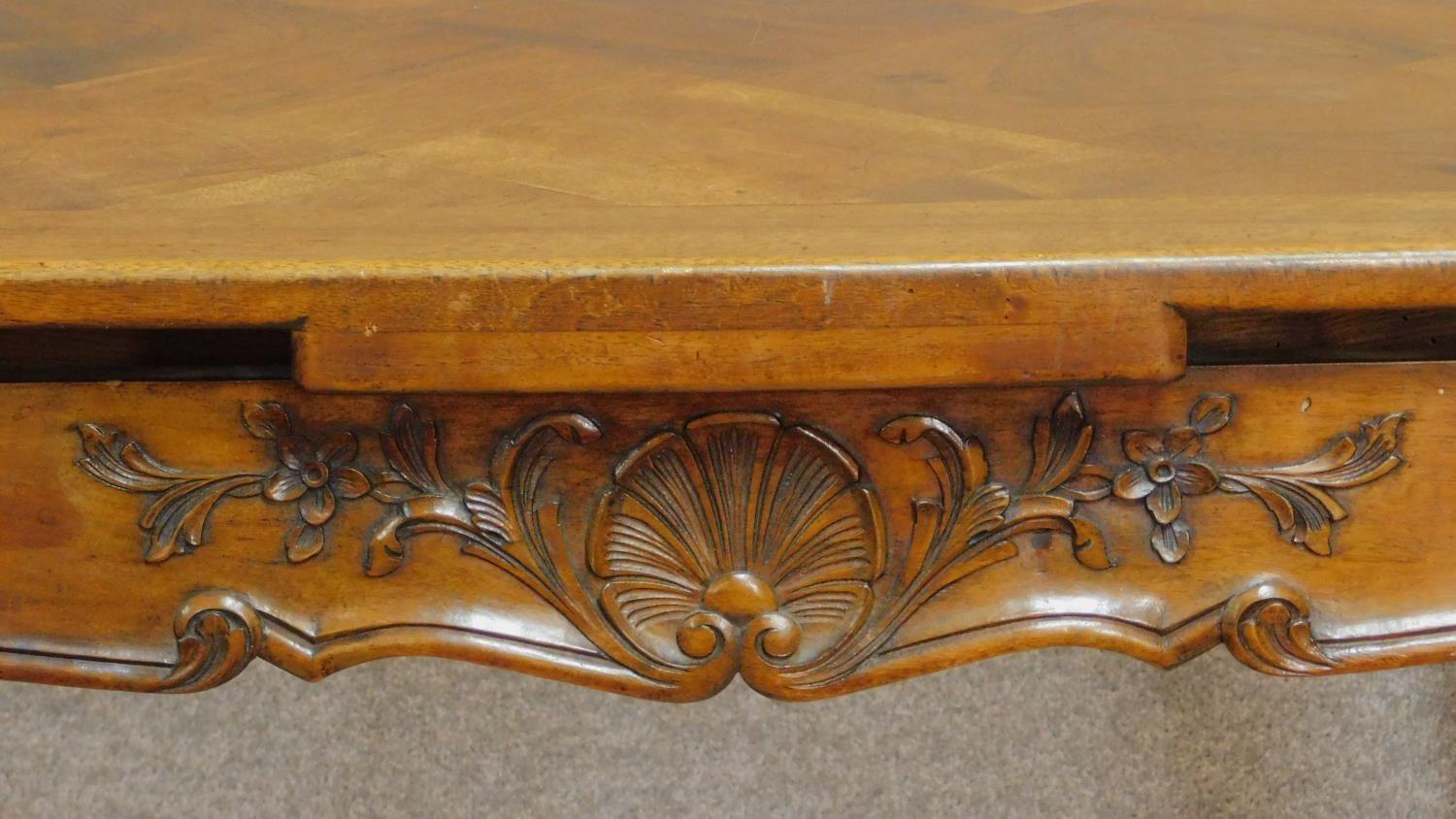 A French walnut draw leaf dining table with parquetry top on well carved base with cabriole - Image 3 of 5