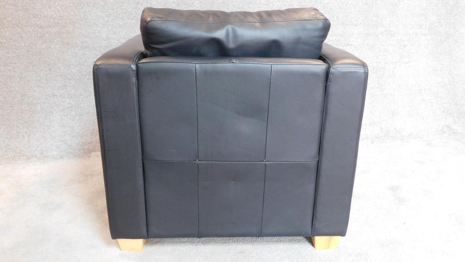 A contemporay black leather armchair on block feet. 70x82x90cm - Image 3 of 3