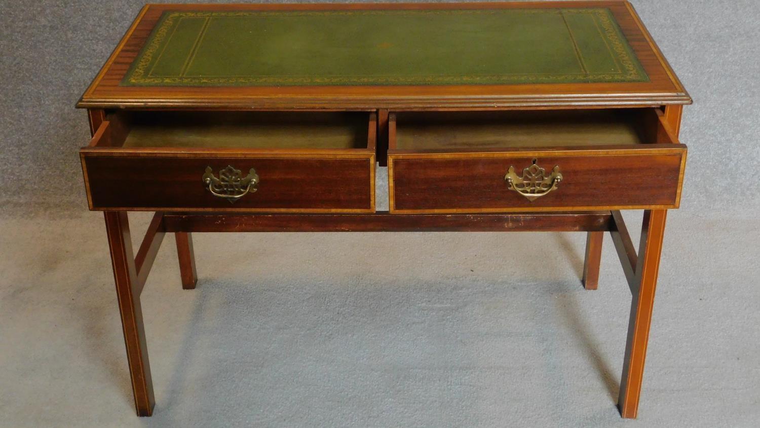 A Sheraton style mahogany and inlaid two drawer writing table on reeded square section stretchered - Image 2 of 7
