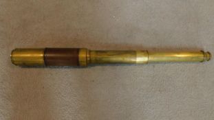 A 19th century three draw brass telescope incribed Dolland London, Night and Day. L.80cm