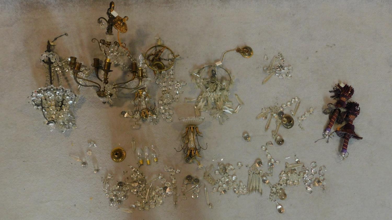 A crystal ceiling chandelier and two other similar light fittings. (A/F and in need of repair, not