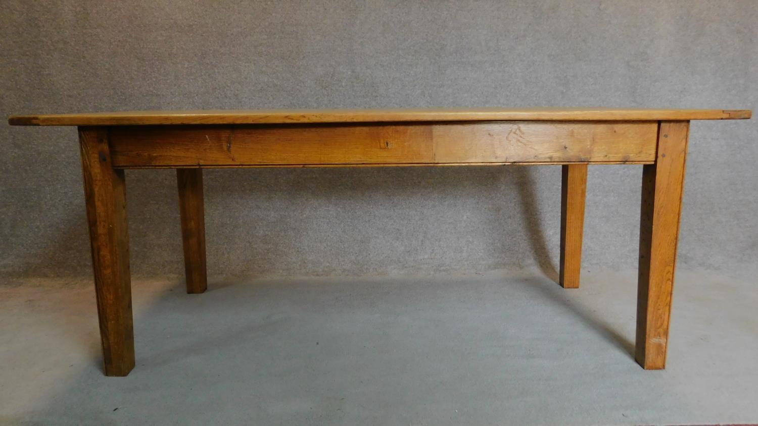 An oak country style planked top refectory table on square tapering supports. H.76 W.193 D.91cm - Image 2 of 5