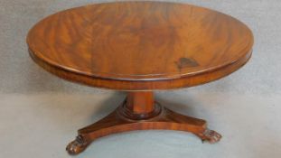 A Victorian mahogany circular tilt top dining table on tripod pedestal base. H.73 W.133cm