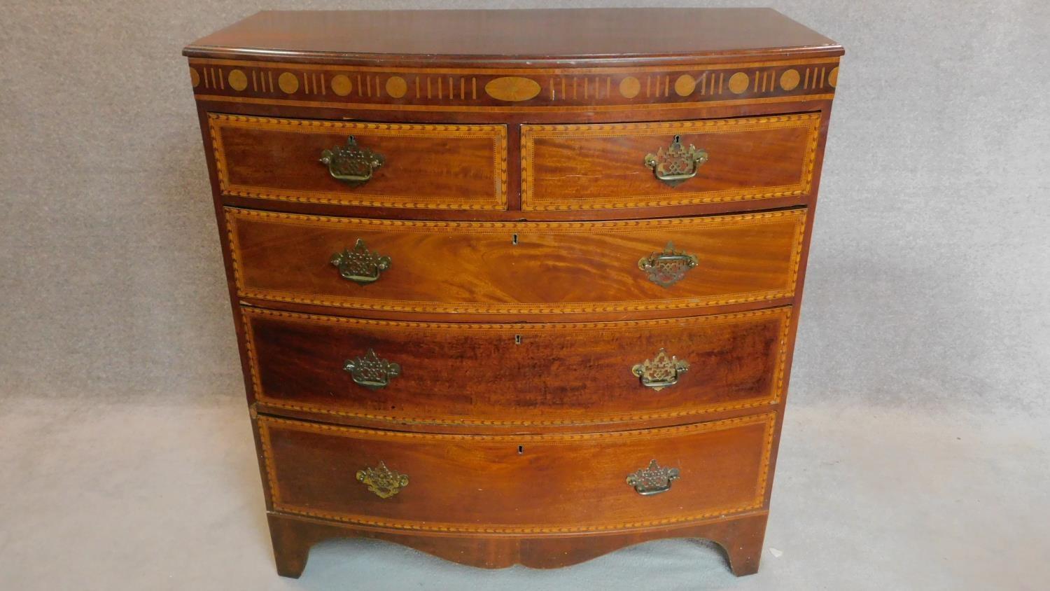 A Georgian mahogany and satinwood inlaid bowfront chest of two short over three long drawers. H. - Image 2 of 7