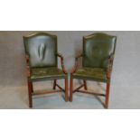 A pair of Georgian style mahogany Gainsborough chairs in green leather upholstery. H.105cm