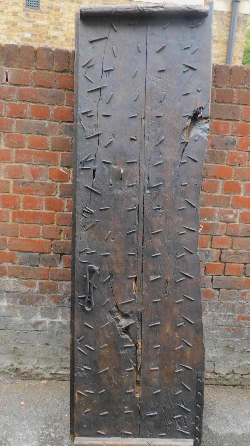 An Antique carved, panelled and studded door from the Kafiristan region of Afghanistan. 217x58cm - Image 5 of 6