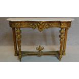 A 19th century Louis XVI style marble topped giltwood console table on reeded tapering supports