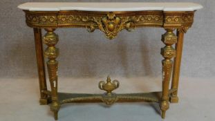 A 19th century Louis XVI style marble topped giltwood console table on reeded tapering supports