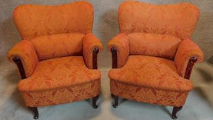 A pair of floral upholstered tub armchairs. H.87