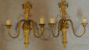 A pair of ormolu two branch wall candelabra. 33x26cm