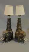 A pair of early 20th century carved teak table lamps in the form of elephants H.50cm