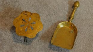 A 19th century brass coal shovel and a similar trivet. W.30cm