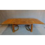 An Arts and Crafts oak draw leaf dining table. 74x255x100cm