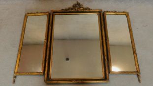 A carved giltwood tryptich table mirror. 110x88cm