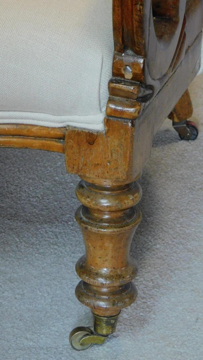 A Victorian mahogany framed buttoned back upholstered easy chair on turned tapering supports. H.91cm - Image 3 of 5