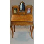 A 19th century Victorian burr walnut bureau de dame fitted cupboards and interior with Arabesque