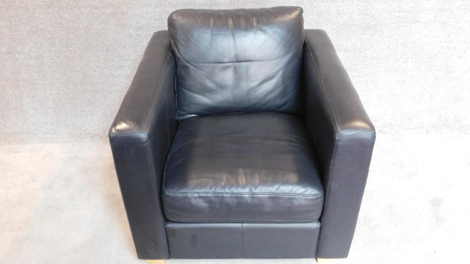 A contemporay black leather armchair on block feet. 70x82x90cm - Image 2 of 3