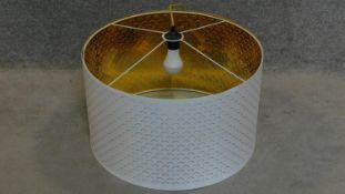 A white cylindrical pendant lamp shade and fitting. 35x60x60cm