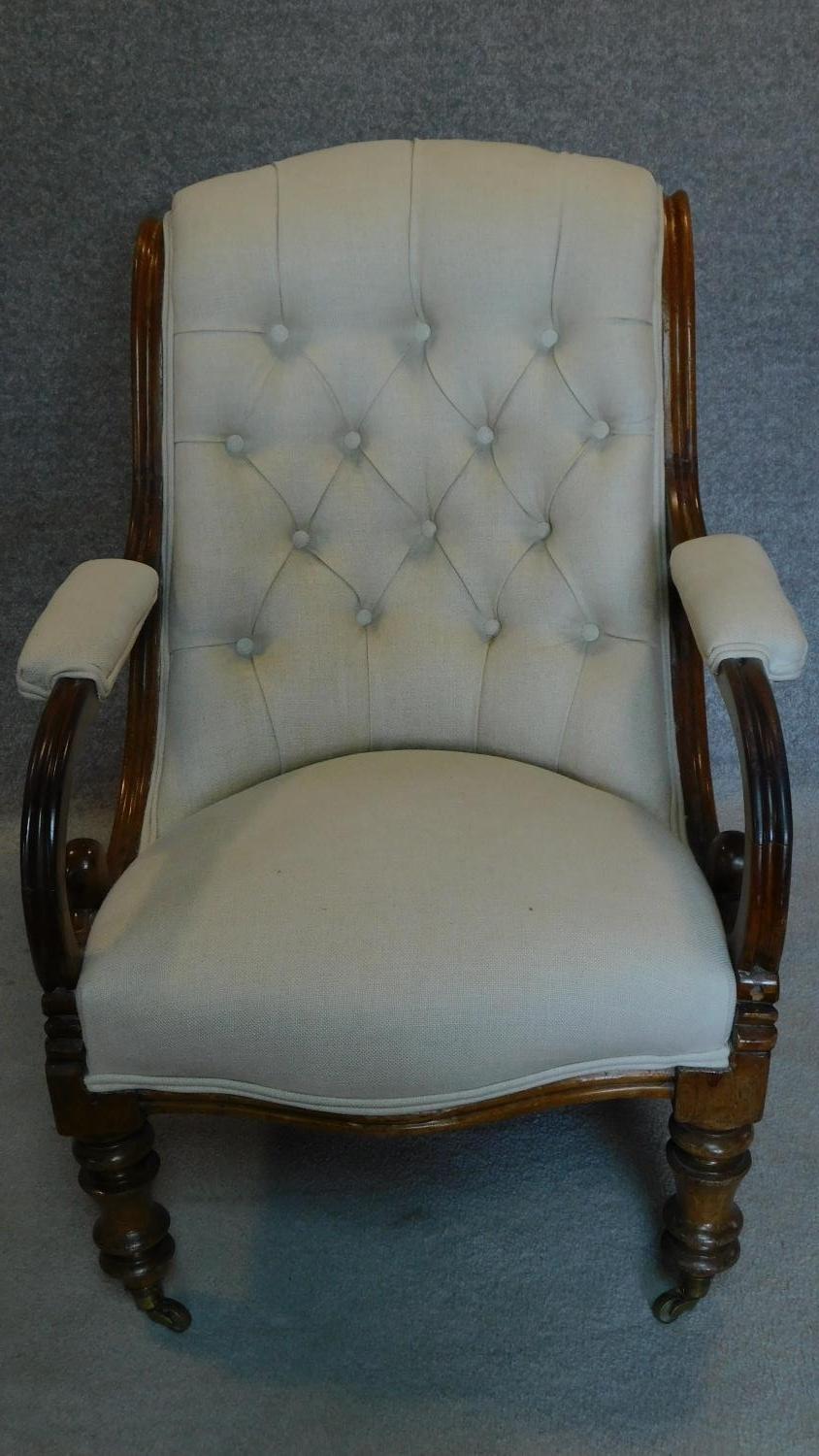 A Victorian mahogany framed buttoned back upholstered easy chair on turned tapering supports. H.91cm - Image 2 of 5