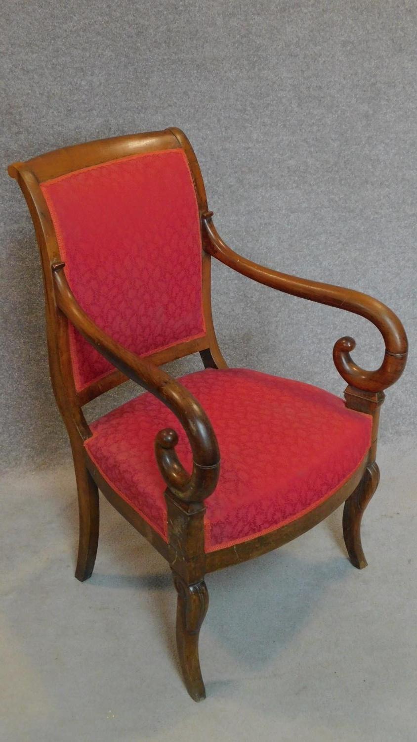 A 19th century mahogany Empire style armchair on cabriole supports. H.92cm