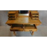 A Victorian Ash aesthetic style dressing table on turned stretchered supports united by undertier.