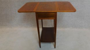 An Edwardian mahogany and satinwood crossbanded drop flap Sutherland table. 78x90x71cm