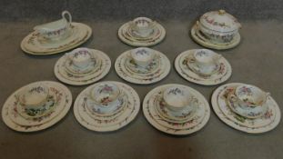 An extensive Wedgwood dinner service for eight, to include dinner plates, side plates etc, soup