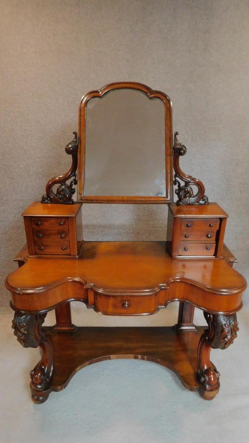 A mid Victorian mahogany Duchess style dressing table. 171x124x54cm