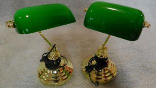 A pair of bankers desk lamps with green adjustable shades. H.36cm