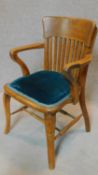 A late 19th century oak desk chair on cabriole supports. H.85cm