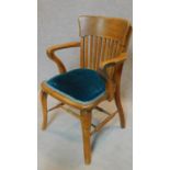 A late 19th century oak desk chair on cabriole supports. H.85cm