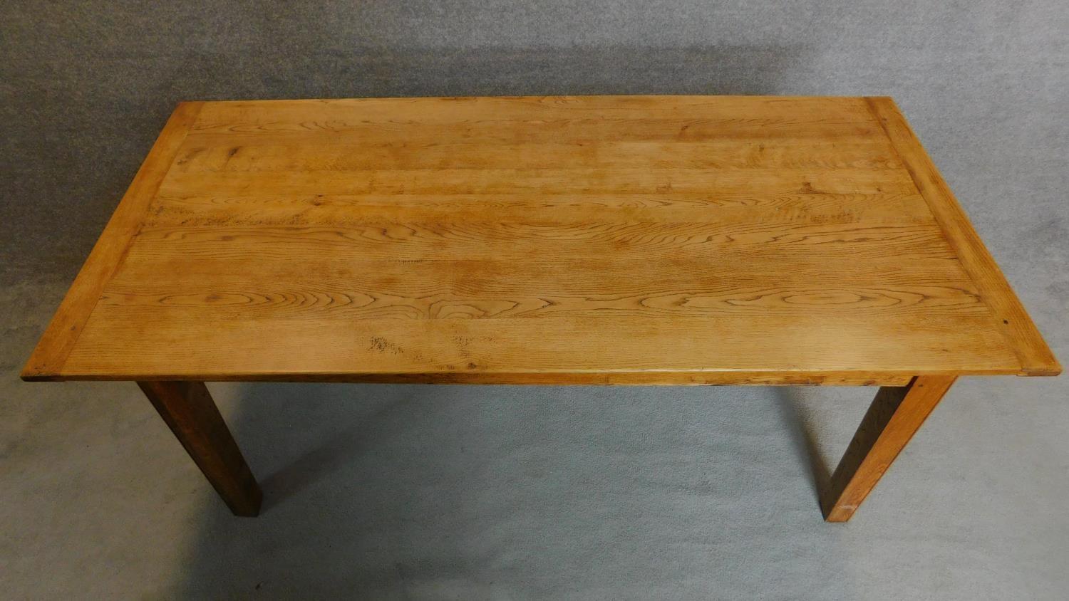 An oak country style planked top refectory table on square tapering supports. H.76 W.193 D.91cm - Image 4 of 5