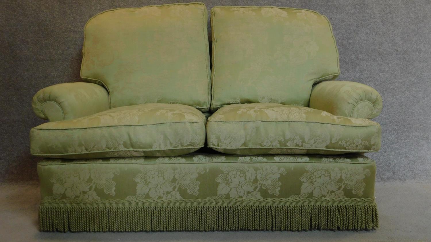 A two seater sofa upholstered in green floral upholstery. 90x145x87cm - Image 2 of 4