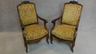 A pair of carved mahogany armchairs on cabriole supports. H.200cm (one back rail is loose)