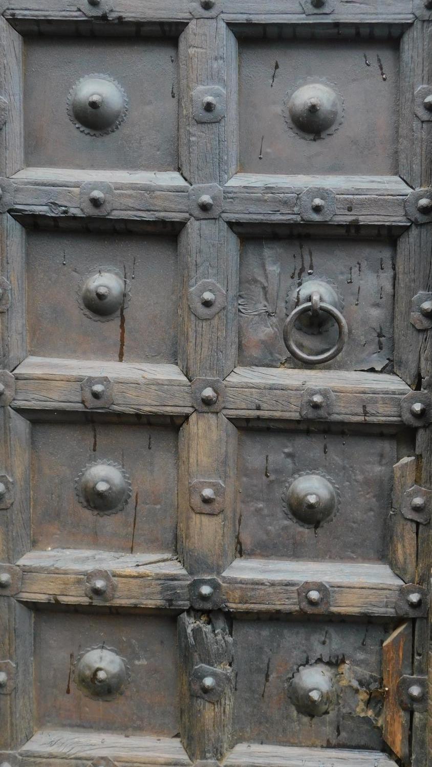 An Antique carved, panelled and studded door from the Kafiristan region of Afghanistan. 217x58cm - Image 2 of 6