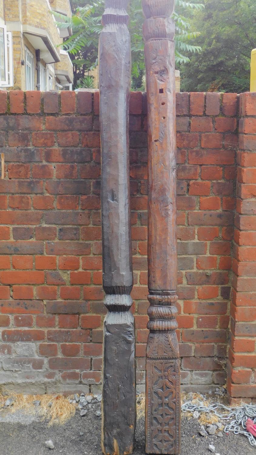 Two antique carved columns from the Kafiristan region of Afghanistan. H.210cm (largest)