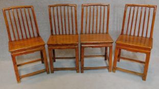 A set of four Chinese style teak dining chairs. H.101cm