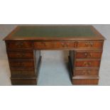 A Georgian style mahogany three section pedestal desk with tooled green leather inset top.