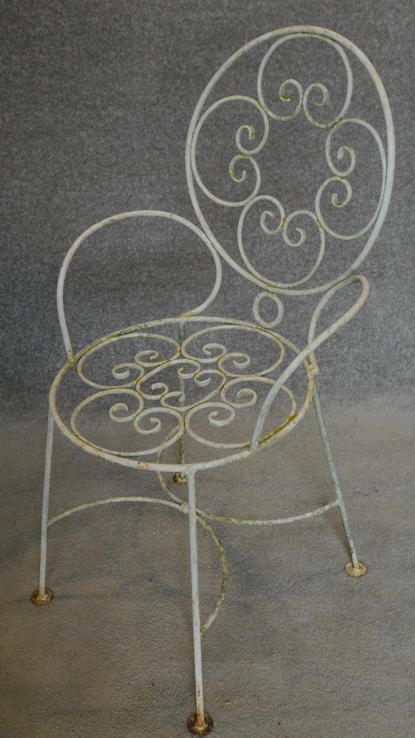 A set of four wrought iron and painted garden chairs. H.87cm - Image 2 of 3