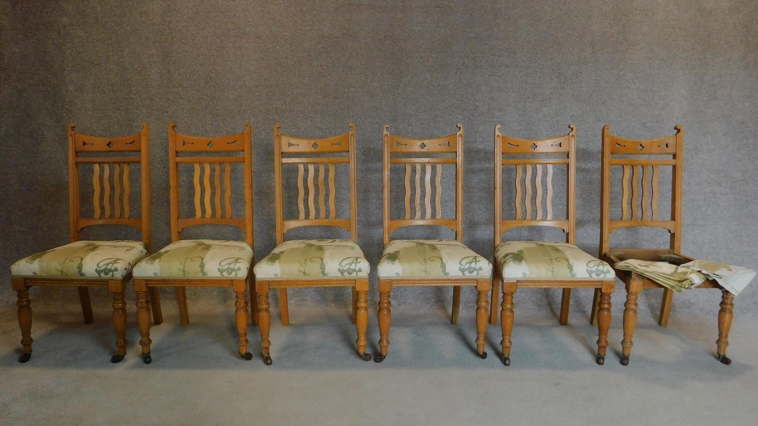 A set of six late 19th century oak Art Nouveau style dining chairs. H.92cm
