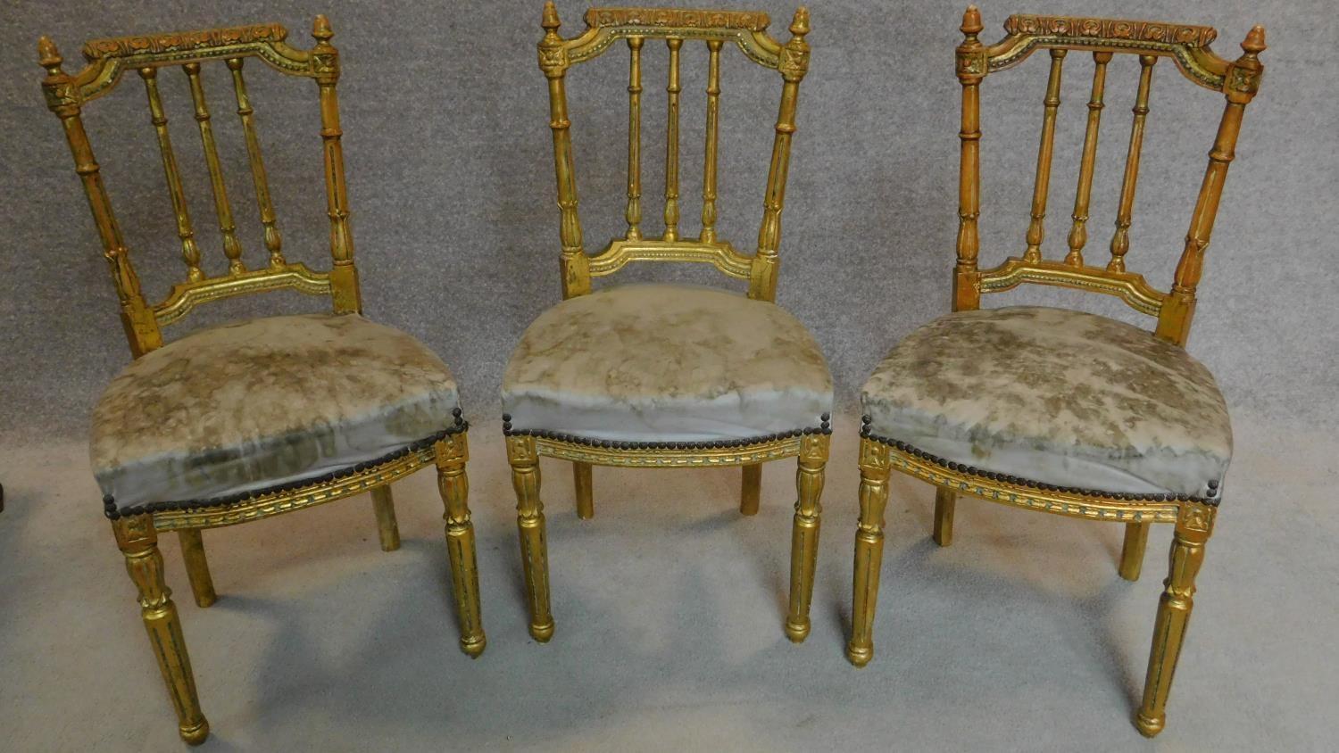 Three gilt framed French style dining chairs. H.86cm