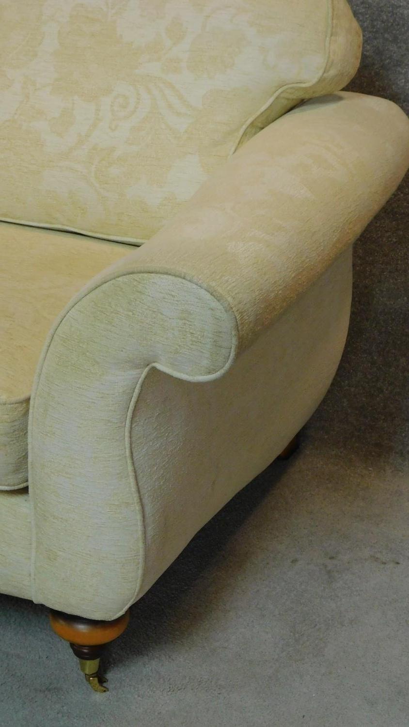 A two seater Victorian style sofa upholstered in beige floral upholstery on turned mahogany feet - Image 4 of 5