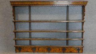 A 19th century poker work wall hanging plate rack fitted with coat hooks to bottom rail. 97x134cm