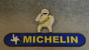 a metal Michelin man figure and a Michelin name plate. 50x9cm