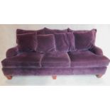 A Victorian style three seater sofa in purple velvet upholstery, makers label: Bernhardt.