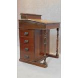 A Edwardian mahogany and inlaid davenport fitted four drawers. 81x53x53cm