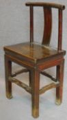 A Chinese teak dining chair on square stretchered supports. H.93cm