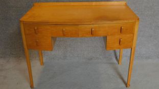 A continental Art Deco satin birch kneehole dressing table. 82x106x53cm