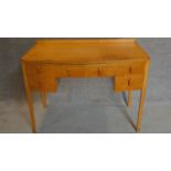 A continental Art Deco satin birch kneehole dressing table. 82x106x53cm